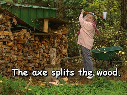 The axe splits the wood.