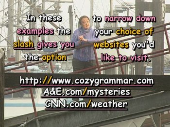 In these examples the slash gives you the option to narrow down your choice of websites you'd like to visit. http://www.cozygrammar.com, A&E.com/mysteries, CNN.com/weather