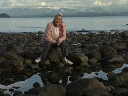 Marie Rackham by a tide pool for the Basic Cozy Grammar Course