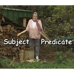 Marie standing with two pieces of firewood to explain what a subject and a predicate are.