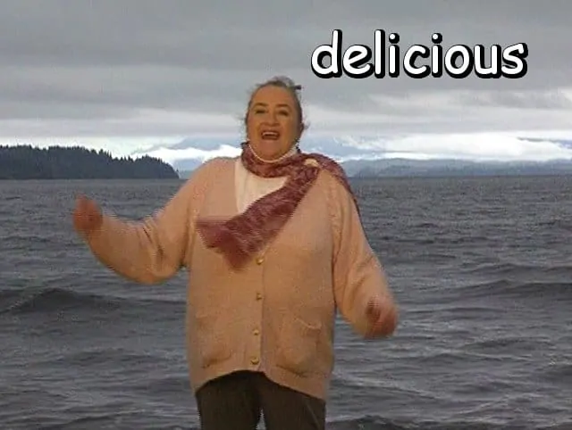 the word "delicious" with Marie in the wind by the waves