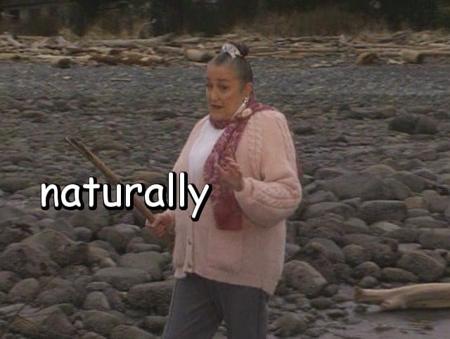 the word "naturally" with Marie walking and talking on the beach