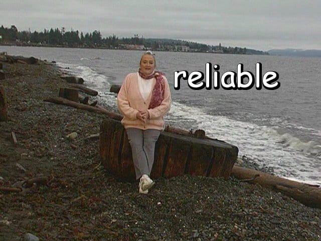 the word "reliable" with Marie on a driftwood round
