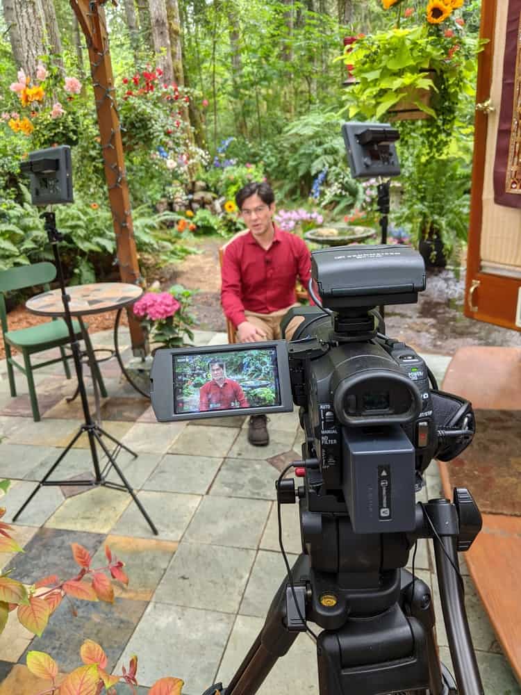 Behind the scenes of filming the Intermediate Cozy Grammar Course, on the patio in front of my cozy writing yurt!