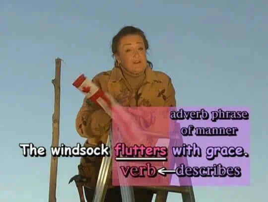 The windsock flutters with grace.
